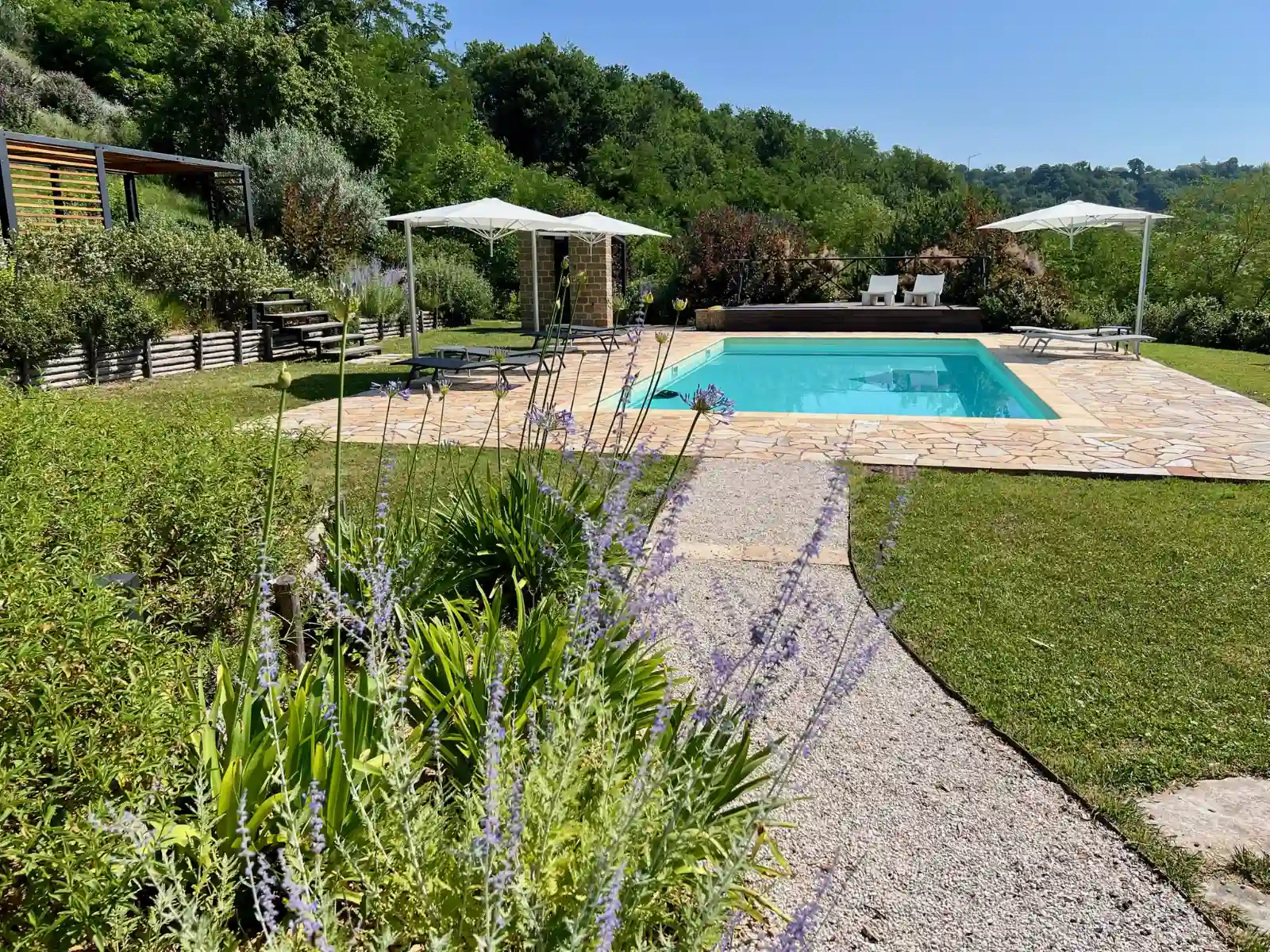 Path leading to the panoramic saltwater swimming pool at Colpo di Fortuna
